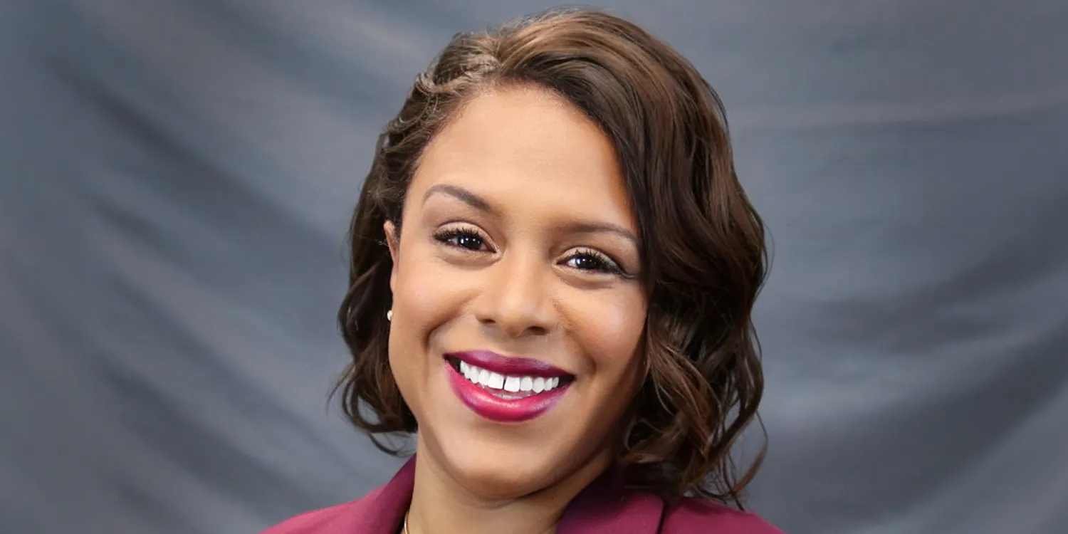 woman with brown hair smiling